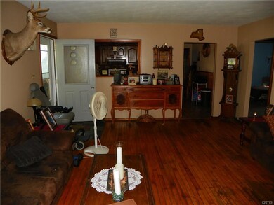Living room with hardwood flooring looking towards