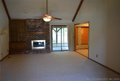 Living room looking out to screened in patio