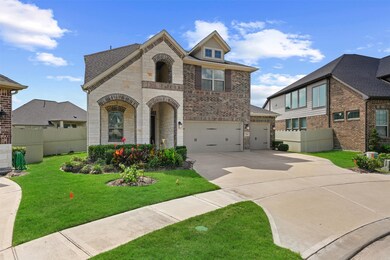 This charming two-story home features a brick and