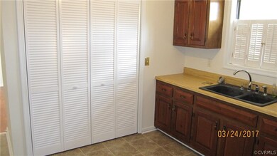 Laundry area is conveniently located behind the bi