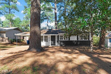 View of front of house with a carport