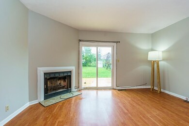 The wood burning fireplace is featured i
