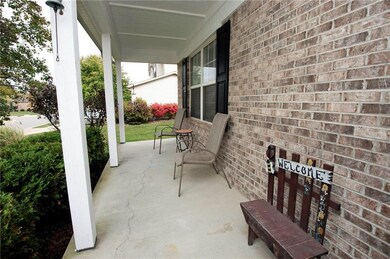 Freshly Painted Front Porch allows for plenty of room to sit and relax while enjoying the friendly neighbors. 
