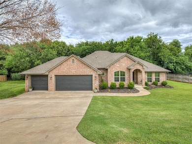 View of front of home with roof with shingles, concrete driveway, and brick siding