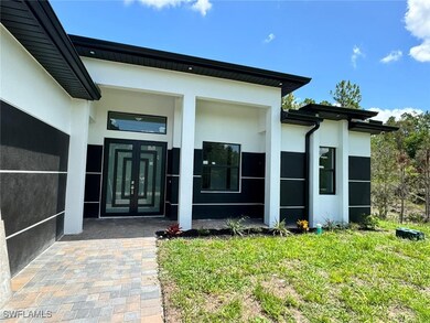Property entrance featuring stucco siding