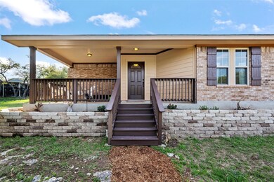 View of exterior entry with brick siding and cove