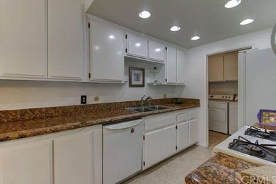 Notice separate laundry room adjacent to kitchen w
