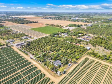 STUNNING AERIAL VIEW OF THIS JAW DROPPING PROPERTY ON ONE FULL ACRE!  BRING YOUR HORSES OR LIVESTOCK!