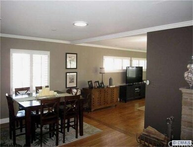 Dining room opens to spacious family room with woo