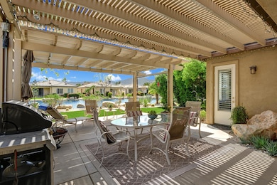 BACK TRELISSED DINING PATIO TO LAKE VIEW