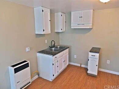 Front unit w/ new white cabinets and granite count