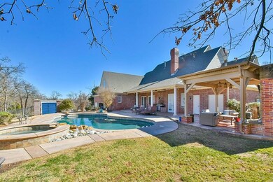 Outdoor pool featuring an outbuilding, a lawn, a p