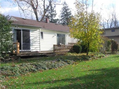 Exterior Back. two sliding glass windows and exten
