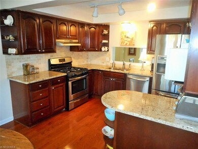 The tile back splash and granite counter tops comp