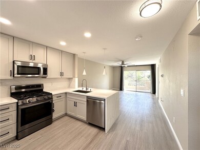 Kitchen with appliances with stainless steel finis