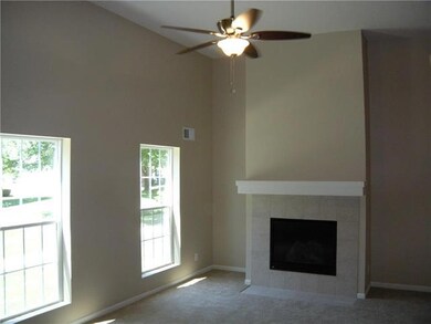 Living room with new ceiling fan, paint and a gas 