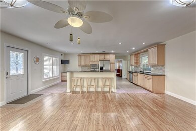 Bamboo floors greet you in living room upon entry