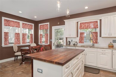 Large eat-in kitchen with door to back deck/yard.