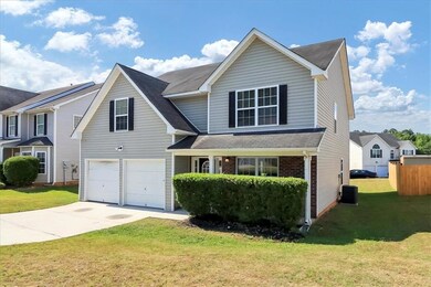 Front facade with central AC, a front lawn, and a 