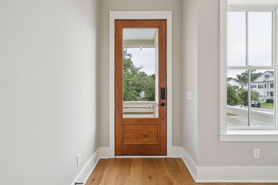 Wood front door and full front porch