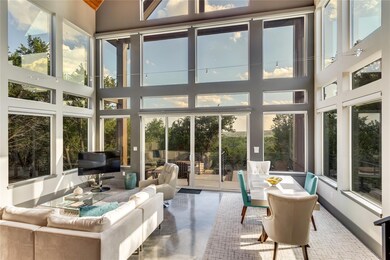 Sunroom / solarium featuring finished concrete fl