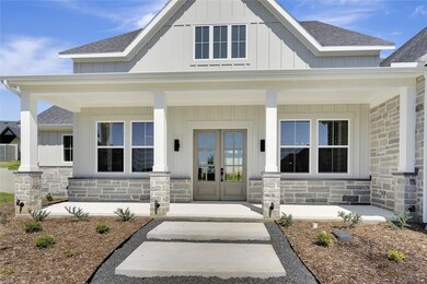 Entrance to property featuring covered porch