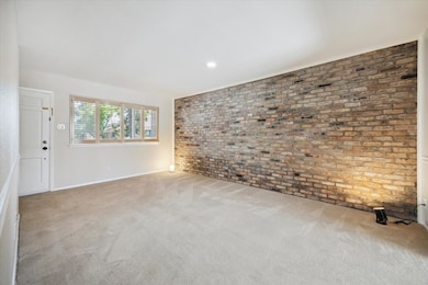 The large Living Rm boasts an exposed Old Chicago brick wall, large window with plantation shutters, and while the plush fairly new carpet has been steam cleaned and ready for move-in, there are authentic hardwood floors underneaath that can be easily sanded and refinished to your desire! Asking Listing Agent for the transferable quote!