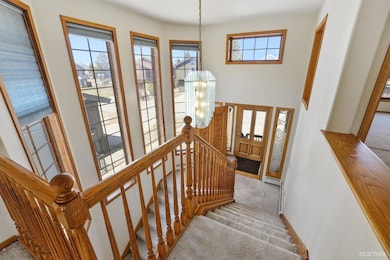 Grand entry way with etched glass and carved front door