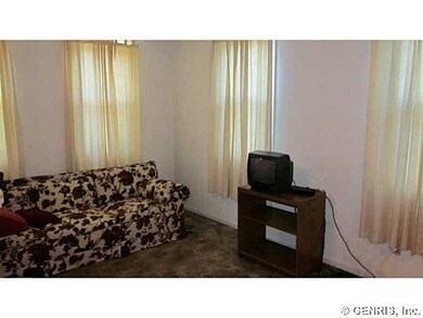 Living Room. Hardwoods under wall to wall carpetin