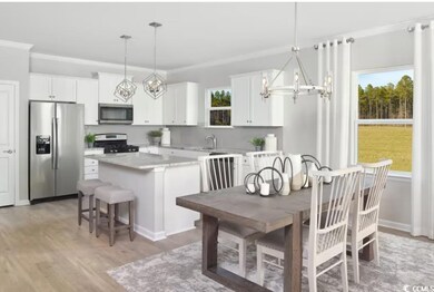 Kitchen featuring an inviting chandelier, a center