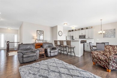 Open floor plan featuring hardwood flooring