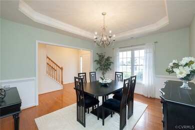 Dining room featuring ornamental molding, an invit