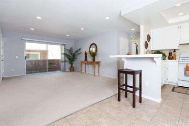 Recessed lighting in both living and kitchen area