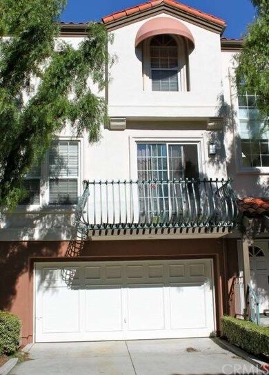 2 car attached garage and view of patio from break