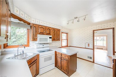 Kitchen Featuring Ample Cabinetry and Tons of Natural Light