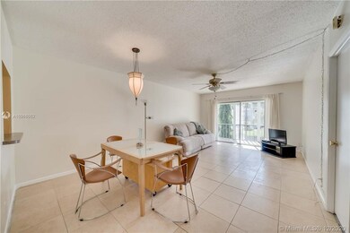 The Dining room / Living room is a large, tiled, l