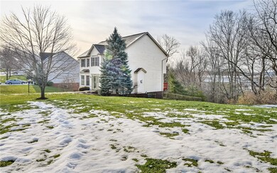 This view shows the community 'green spaces' to the near side of this image (cut lawn) AND the rear woodlands green space (left natural).