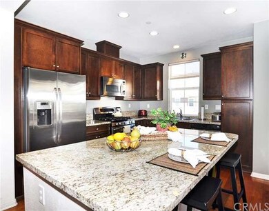 Large kitchen island with granite countertop. 