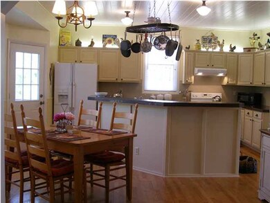 An overview of the large custom kitchen with door 