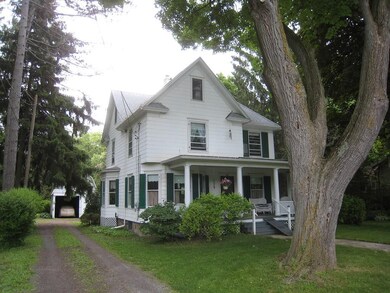 Side, driveway, garage view.