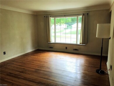 Spacious living room with wood floors.