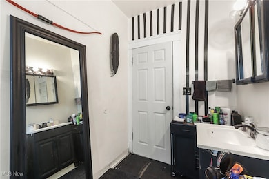 Bathroom featuring vanity and baseboards