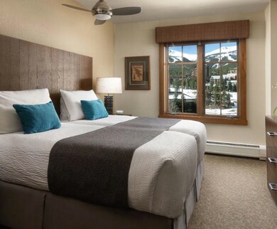 Bedroom featuring a baseboard radiator and ceiling
