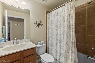 Bathroom featuring visible vents, shower / bath co