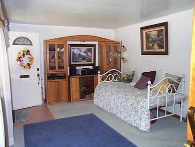 Living Room. The doorway enters into the living room.  All rooms have wall to wall carpeting.