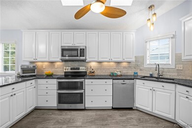 Kitchen with skylights and ceiling fan, GE stainle