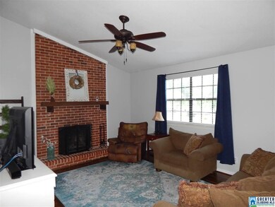 Great room offers a charming brick fireplace with 