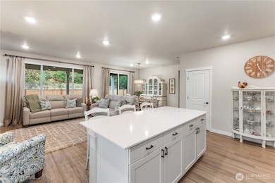 The living/dining room directly off the kitchen is perfect for entertaining.