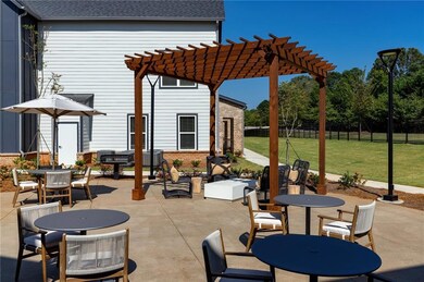 View of patio with outdoor dining area and a pergola