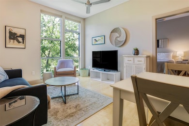 Living area featuring ceiling fan